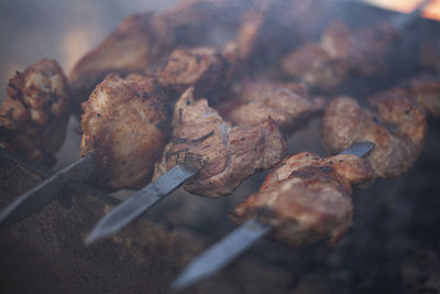 High angle view of meat on barbecue