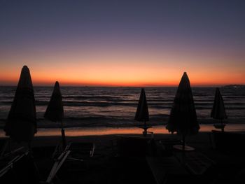 Scenic view of sea against clear sky during sunset