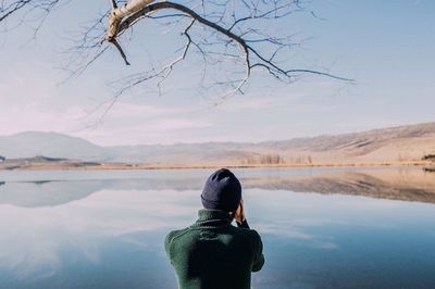 Rear view of woman in lake