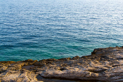 High angle view of rock formation in sea