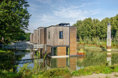 Row of wood-cladded floating villas in nassauhaven harbour