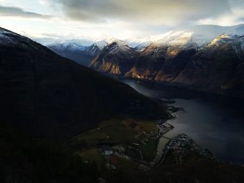 Scenic view of lake and mountains against sky