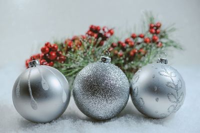 Close-up of christmas decorations over white background