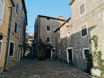 Empty street of a picturesque old town, stone buildings, village, nobody, no people.