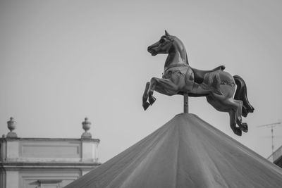 Low angle view of statue against clear sky