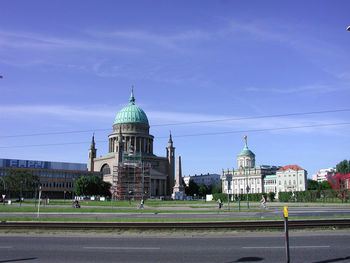 Buildings in city against sky