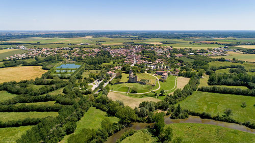 Scenic view of agricultural field against clear sky