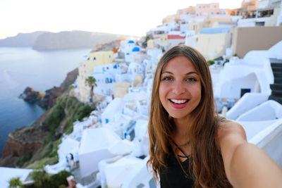 Portrait of smiling young woman in water