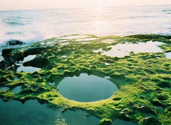 High angle view of sea shore against sky