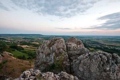 Rock formations on landscape against sky