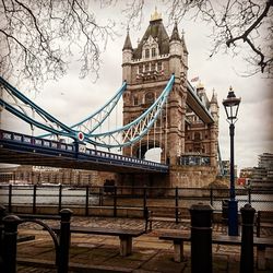 View of bridge over river in city