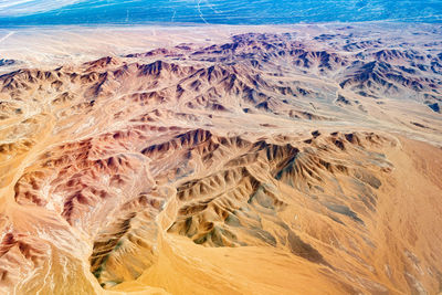 Aerial view of dry rivers and mountains in the altiplano of the atacama desert, chile.