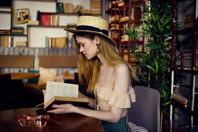 Young woman reading book