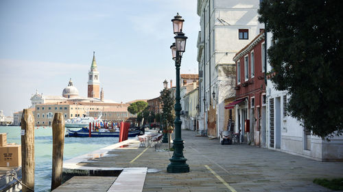 View of street amidst buildings in city