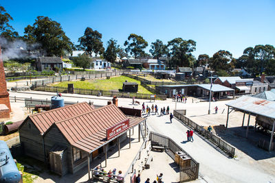 High angle view of people in city against sky