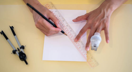 Cropped image of business colleagues working on table