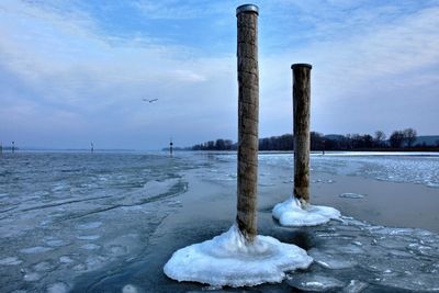 Scenic view of frozen lake against sky