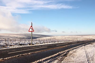 Scenic view of landscape against sky during winter