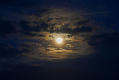 Low angle view of moon at sunset