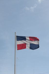 Low angle view of flag against sky