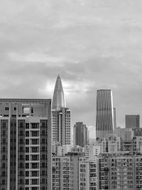 Buildings in city against sky