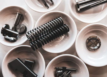 High angle view of hand tools in container on table