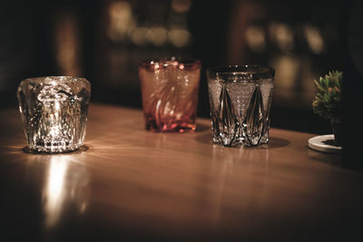 Close-up of wine glasses on table