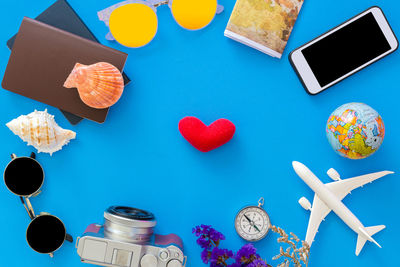 High angle view of cupcakes on table against blue background