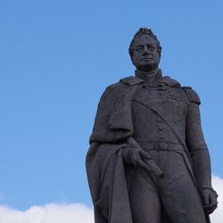 Low angle view of statue against sky