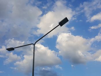 Low angle view of street light against sky