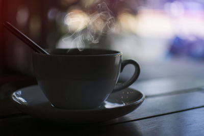 Close-up of coffee cup on table