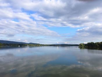Reflection of clouds in calm lake