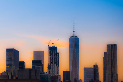 View of modern buildings against sky during sunset