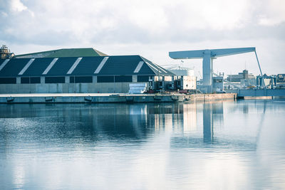 View of factory against cloudy sky