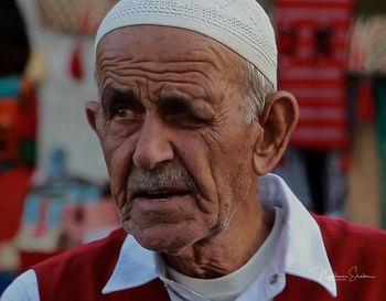 Close-up portrait of man wearing sunglasses