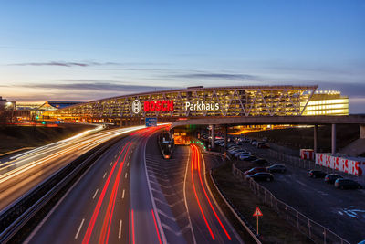 High angle view of light trails on road at night