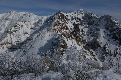 Scenic view of snowcapped mountains against sky