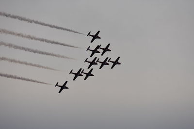 Low angle view of airplane flying in sky