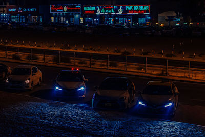 Traffic on road in city at night