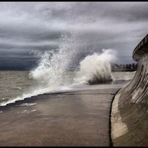 Scenic view of sea against cloudy sky