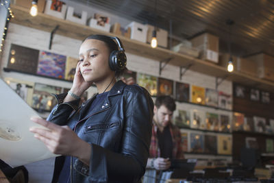 Young woman in a record store.