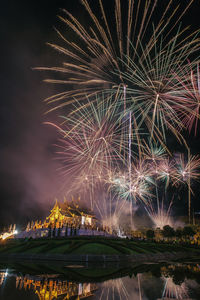 Firework display in city at night