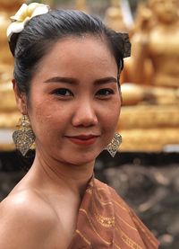 Close-up portrait of smiling young woman