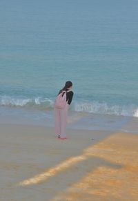 Rear view of woman on beach