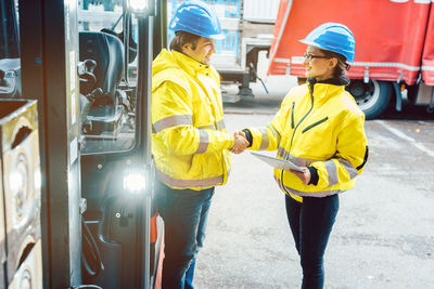 Rear view of people working