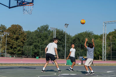 People playing soccer at park