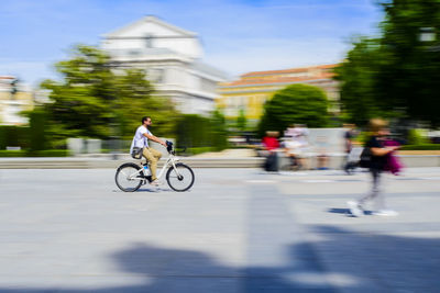 Man riding bicycle on road