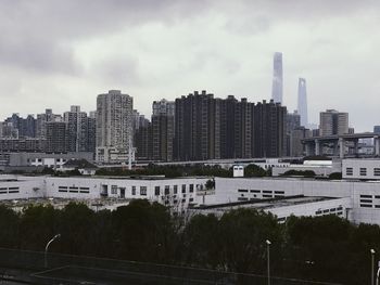 High angle view of buildings in city against sky