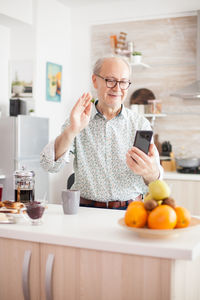 Senior man doing video call at home