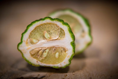 Close-up of lemon slice on table